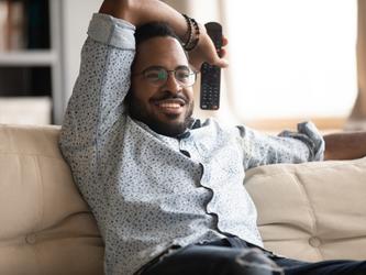 Person of colour watching television
